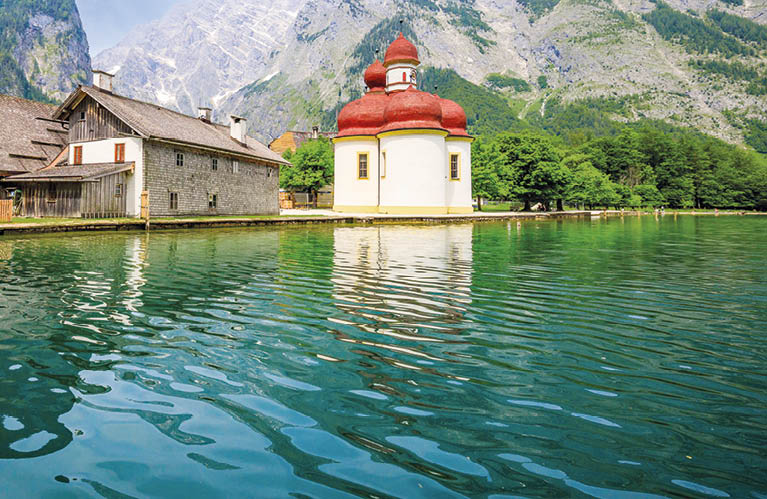 Schonau am Konigsee, Germany. Konigssee lake in Berchtesgadener Land. St. Bartholomews (Bartholoma) church and Watzmann mountain.